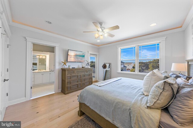 bedroom featuring ornamental molding, light hardwood / wood-style floors, ceiling fan, and ensuite bathroom