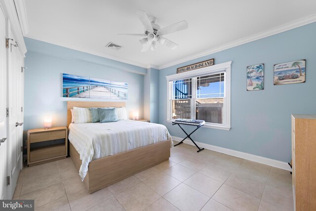 tiled bedroom featuring ornamental molding and ceiling fan