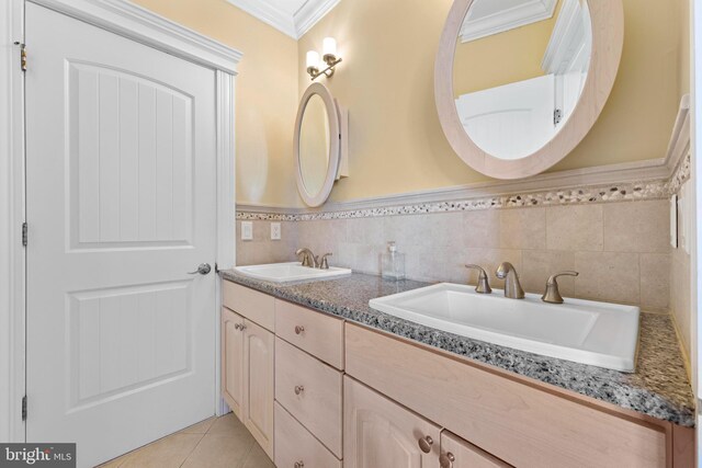 bathroom featuring crown molding, tile patterned floors, vanity, and tile walls