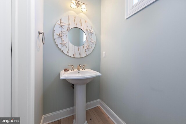 bathroom featuring sink and hardwood / wood-style floors