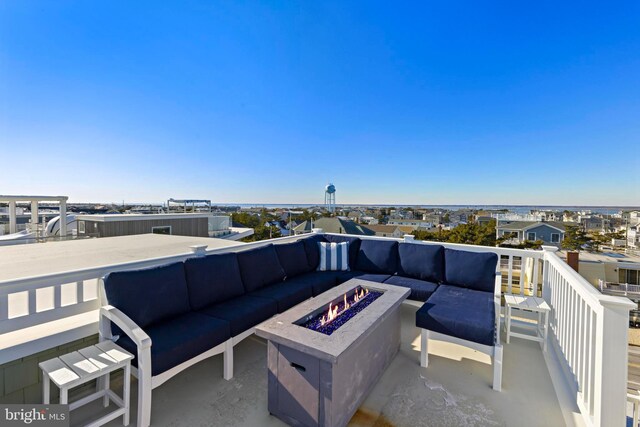 view of patio / terrace featuring an outdoor living space with a fire pit