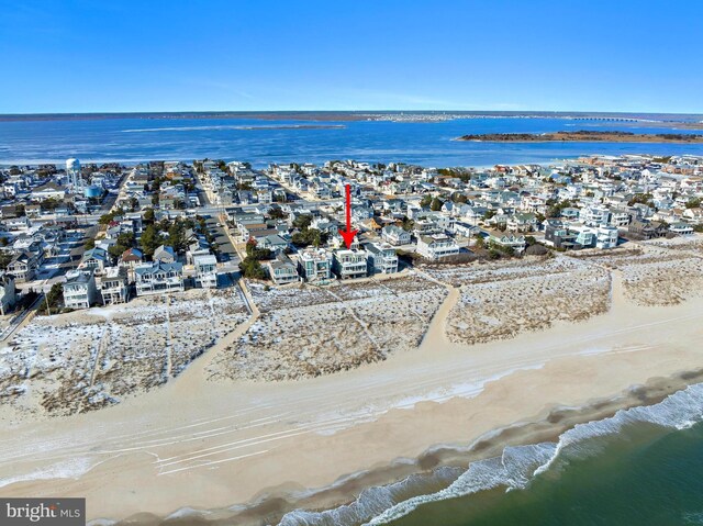 bird's eye view featuring a beach view and a water view