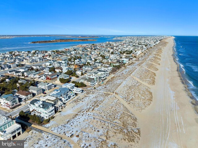 bird's eye view with a view of the beach and a water view