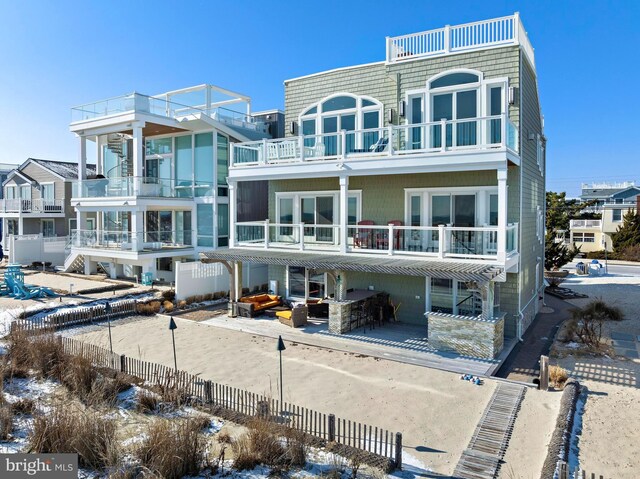 rear view of house with an outdoor hangout area