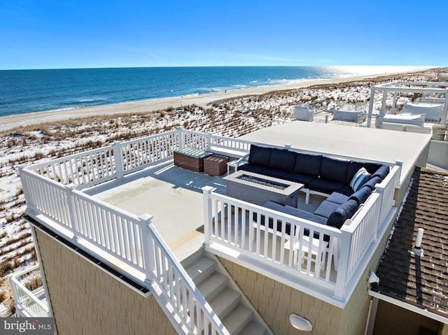 drone / aerial view with a view of the beach and a water view