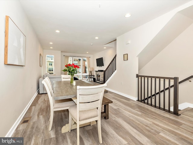 dining space featuring light hardwood / wood-style floors