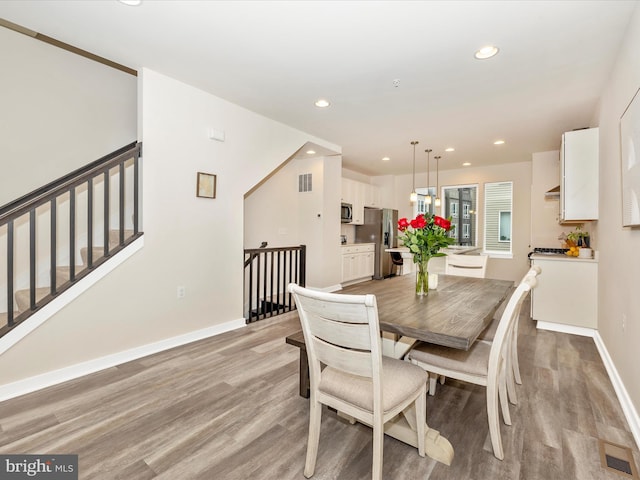 dining area featuring light wood-type flooring