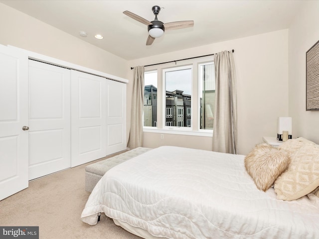 bedroom featuring ceiling fan, carpet flooring, and a closet