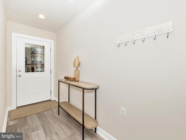 doorway with light hardwood / wood-style flooring