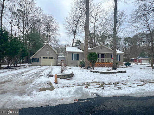 view of front of home featuring a garage and a porch