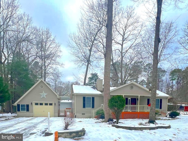 view of front of home with a garage and a porch