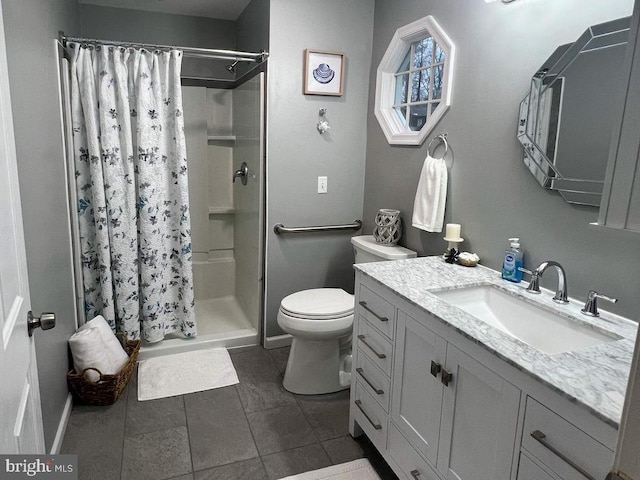 bathroom with toilet, vanity, a shower with curtain, and tile patterned flooring