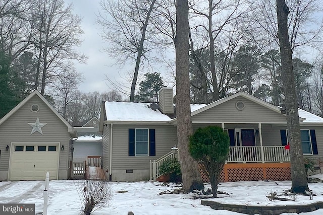 view of front of house with covered porch and a garage