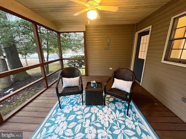 sunroom / solarium with ceiling fan