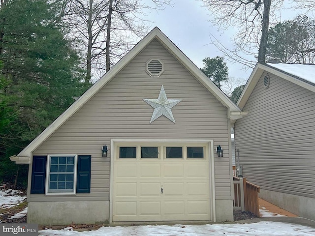 view of snow covered garage