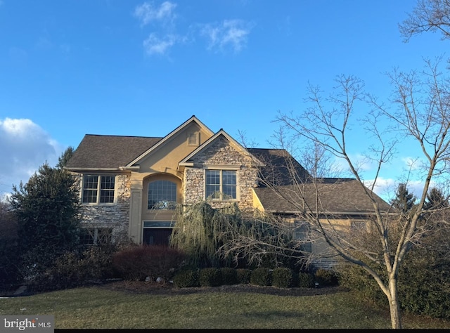 view of front of home with a front lawn