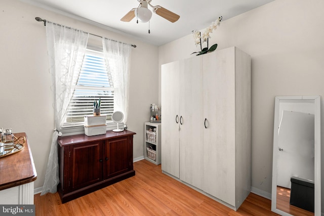 bedroom with ceiling fan and light hardwood / wood-style flooring