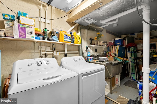 laundry area featuring washing machine and clothes dryer