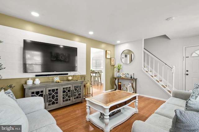 living room with light hardwood / wood-style flooring