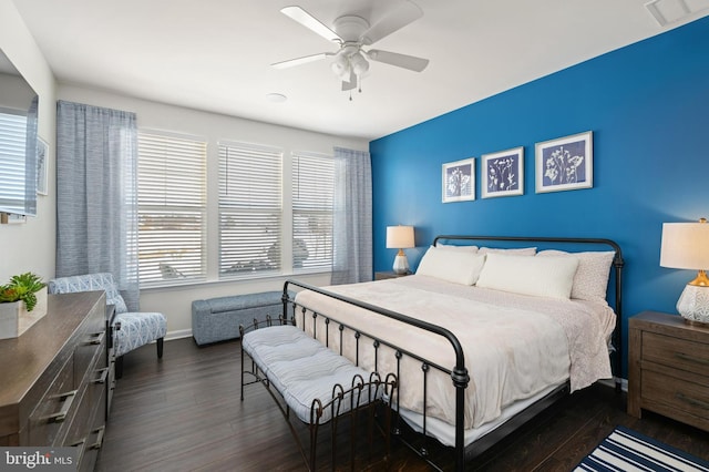 bedroom with dark wood-type flooring and ceiling fan