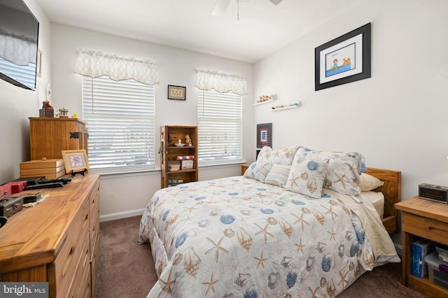 bedroom featuring ceiling fan and dark colored carpet