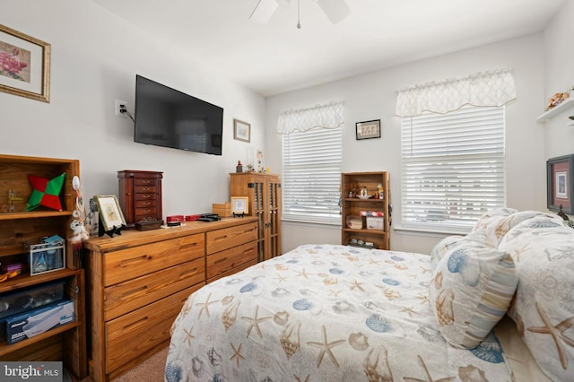 bedroom featuring ceiling fan and carpet floors