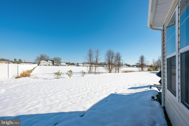 view of yard covered in snow