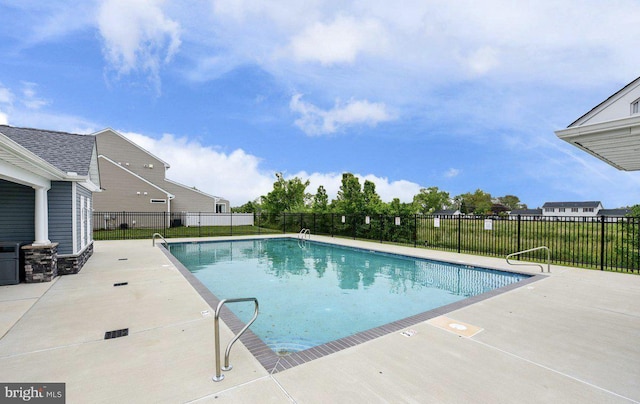 view of swimming pool with a patio