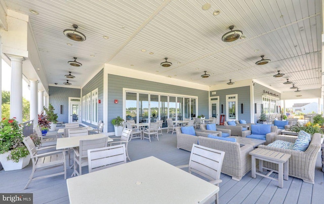 deck with ceiling fan and an outdoor hangout area