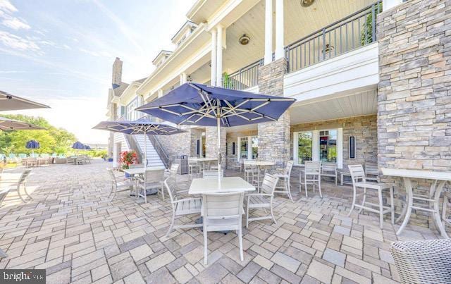 view of patio featuring a balcony