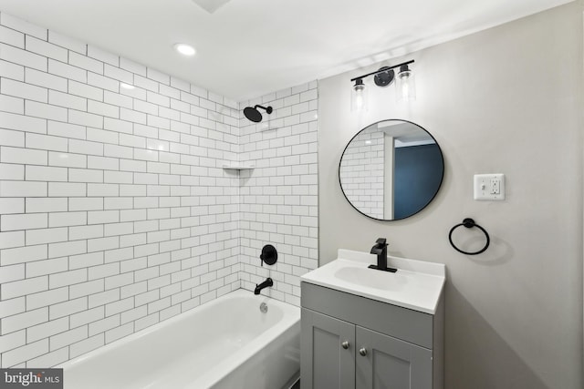 bathroom with vanity and tiled shower / bath combo