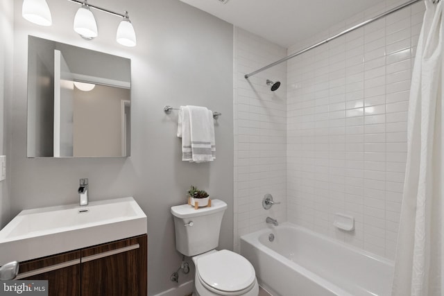 bathroom featuring shower / bath combination with curtain, vanity, and toilet