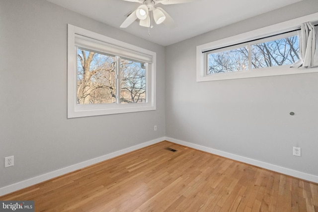 unfurnished bedroom with light wood-style flooring, visible vents, ceiling fan, and baseboards