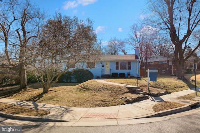 single story home with a front yard