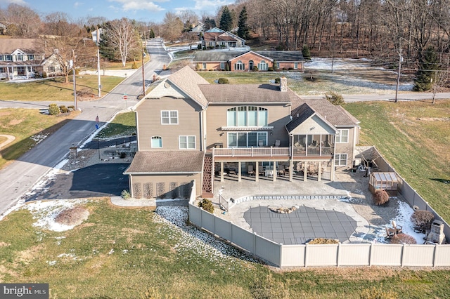 rear view of house featuring a deck