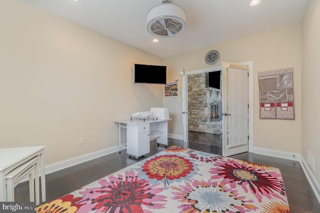 bedroom with dark hardwood / wood-style flooring