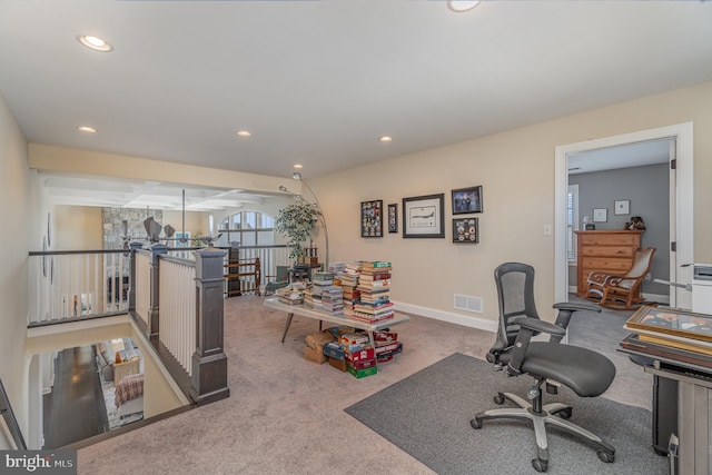 office area with carpet and beam ceiling