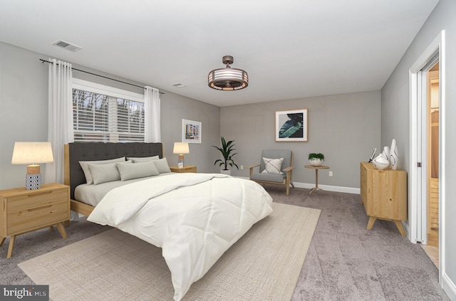 bedroom featuring light colored carpet