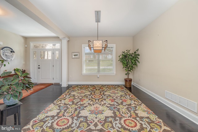 entryway with dark hardwood / wood-style floors