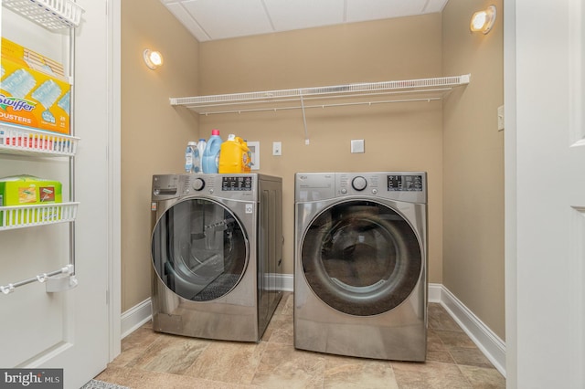 laundry room featuring washing machine and dryer