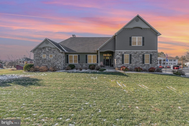 view of front of home with a lawn