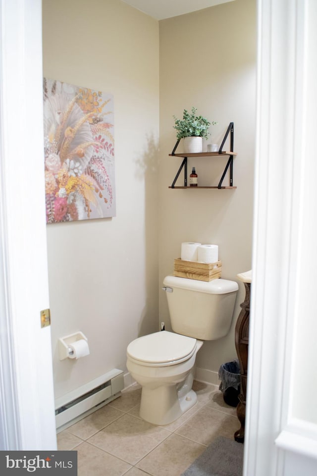 bathroom featuring toilet, tile patterned floors, and a baseboard radiator