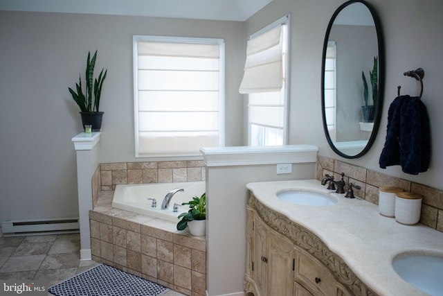 bathroom featuring a baseboard radiator, tiled tub, and vanity