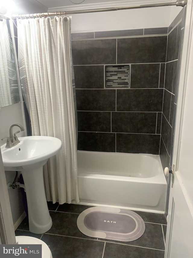 bathroom featuring toilet, shower / bath combination with curtain, and tile patterned floors