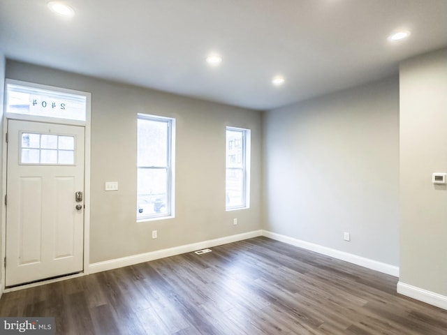 foyer entrance featuring dark hardwood / wood-style floors