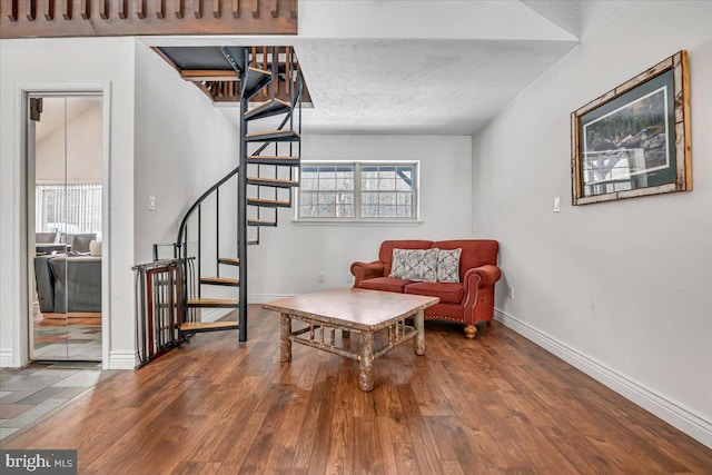 living area with hardwood / wood-style flooring