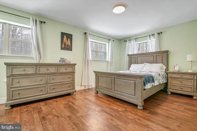 bedroom featuring dark hardwood / wood-style flooring