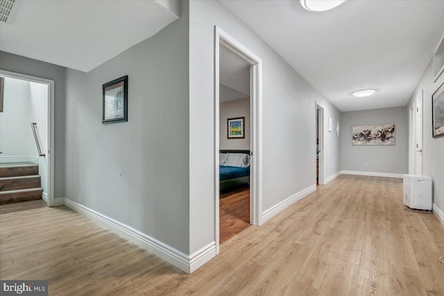 corridor featuring light hardwood / wood-style flooring