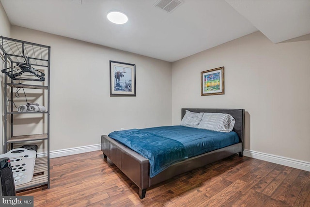 bedroom featuring dark hardwood / wood-style flooring