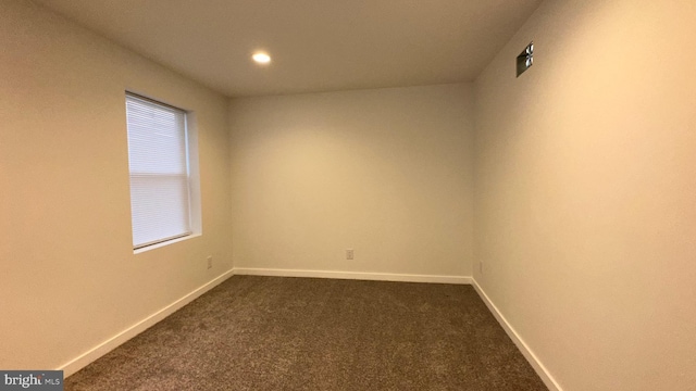 unfurnished room with carpet flooring